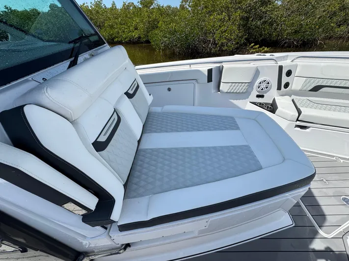  Yacht Photos Pics Luxurious seating on 2024 Blackfin 332 CC boat, featuring white and gray upholstery.