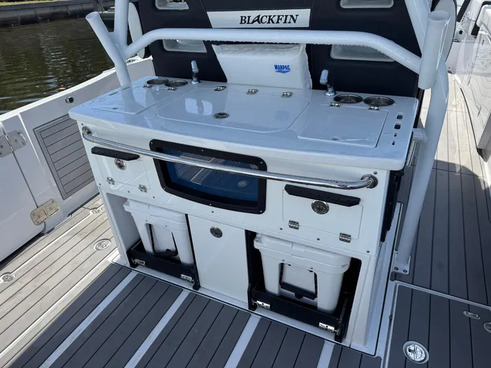  Yacht Photos Pics 2024 Blackfin 332 CC boat interior with fishing station and storage compartments.