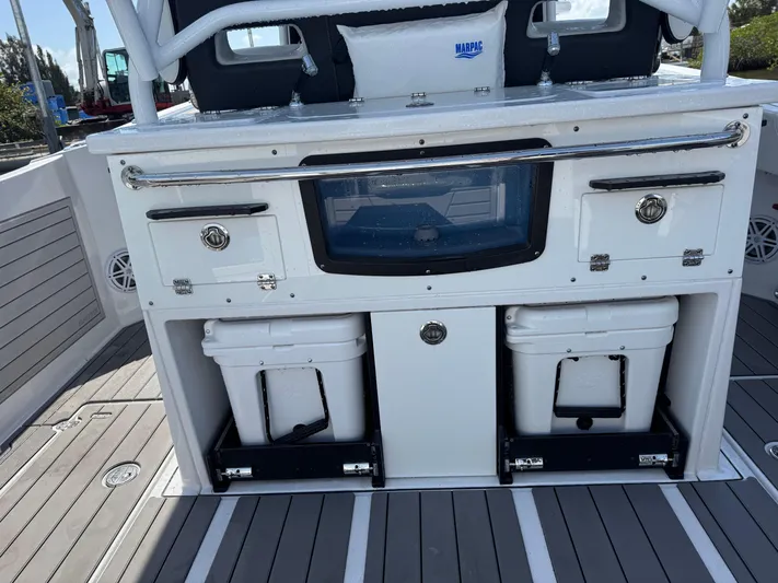  Yacht Photos Pics 2024 Blackfin 332 CC boat interior with storage compartments and coolers on deck.