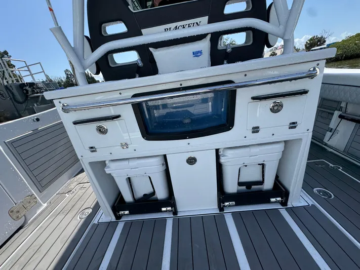  Yacht Photos Pics 2024 Blackfin 332 CC boat interior with storage compartments and seating.