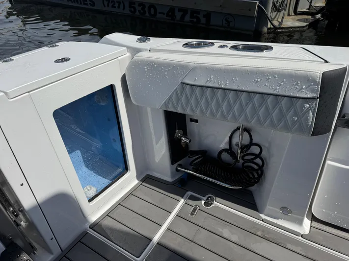  Yacht Photos Pics 2024 Blackfin 332 CC boat deck with storage and seating area.