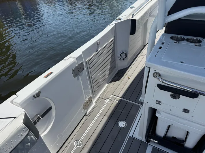  Yacht Photos Pics 2024 Blackfin 332 CC boat interior with sleek deck and storage compartments.