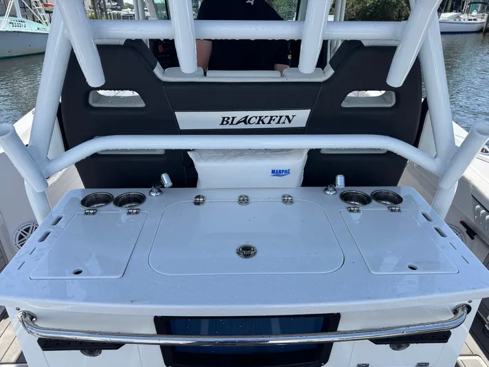  Yacht Photos Pics 2024 Blackfin 332 CC boat console with cup holders and storage compartments.