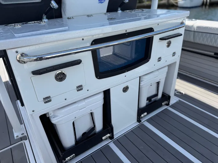  Yacht Photos Pics 2024 Blackfin 332 CC boat console with storage compartments and sleek design.