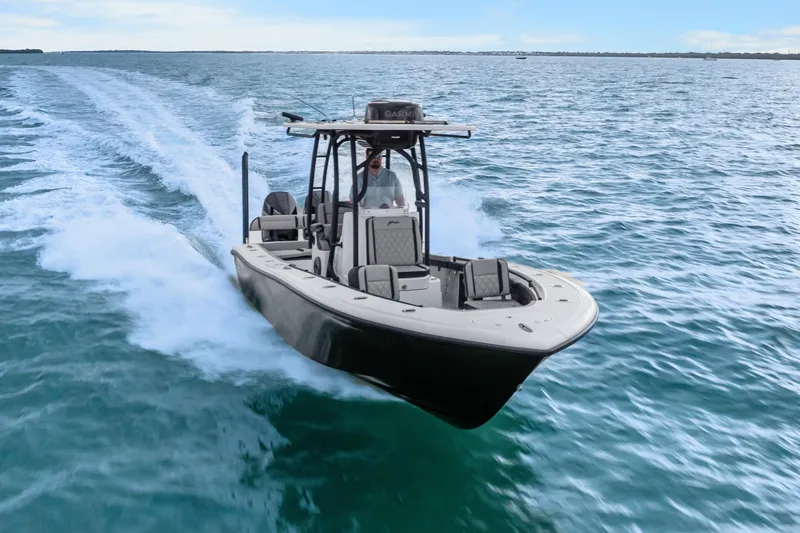  Yacht Photos Pics 2025 Yellowfin 26 Hybrid boat cruising on open water, showcasing sleek design and performance.