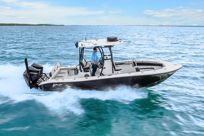  Yacht Photos Pics 2025 Yellowfin 26 Hybrid boat cruising on open water, showcasing sleek design and performance.