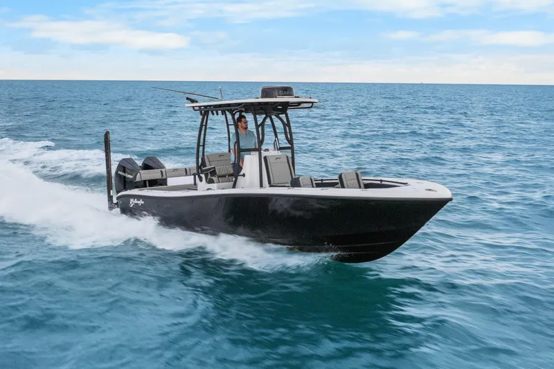  Yacht Photos Pics 2025 Yellowfin 26 Hybrid boat cruising on open ocean waters.