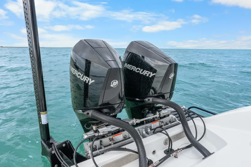  Yacht Photos Pics Twin Mercury outboard engines on a 2025 Yellowfin 26 Hybrid boat in open water.