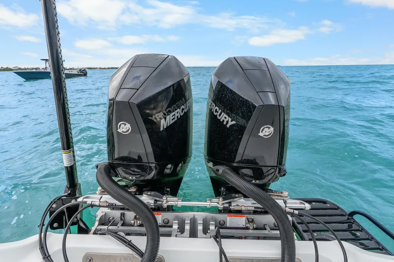  Yacht Photos Pics 2025 Yellowfin 26 Hybrid boat with dual Mercury outboard engines on the ocean.