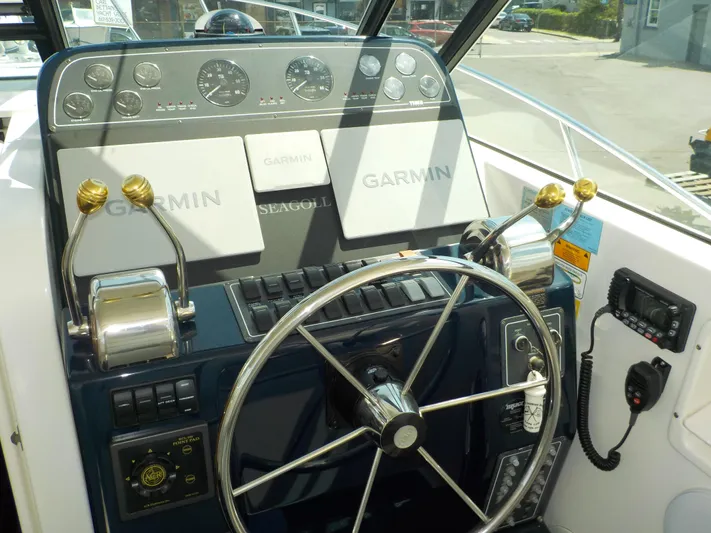 " Sea Goll " Yacht Photos Pics 2003 Tiara Yachts 3100 Open helm with Garmin navigation and control panel.