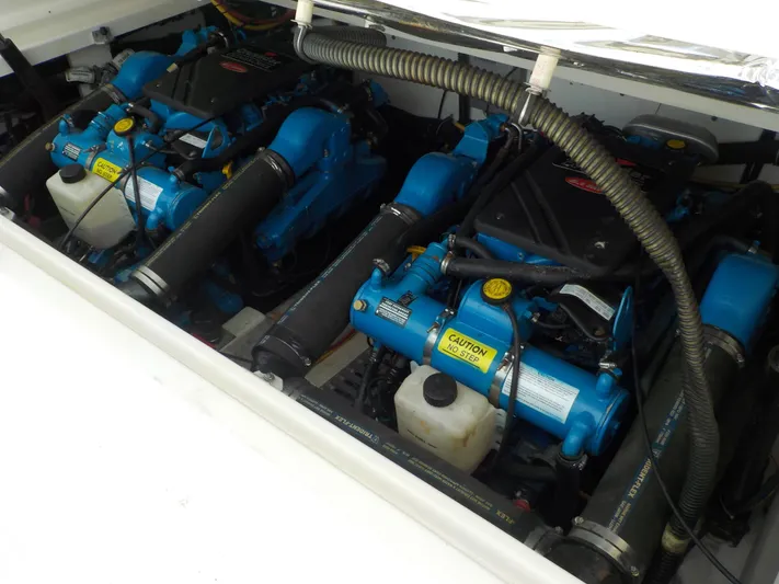 " Sea Goll " Yacht Photos Pics Engine compartment of a 2003 Tiara Yachts 3100 Open, featuring dual blue marine engines.