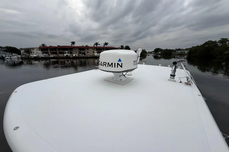  Yacht Photos Pics 2009 Jupiter 29 boat with Garmin radar on deck, overcast sky, waterfront view.