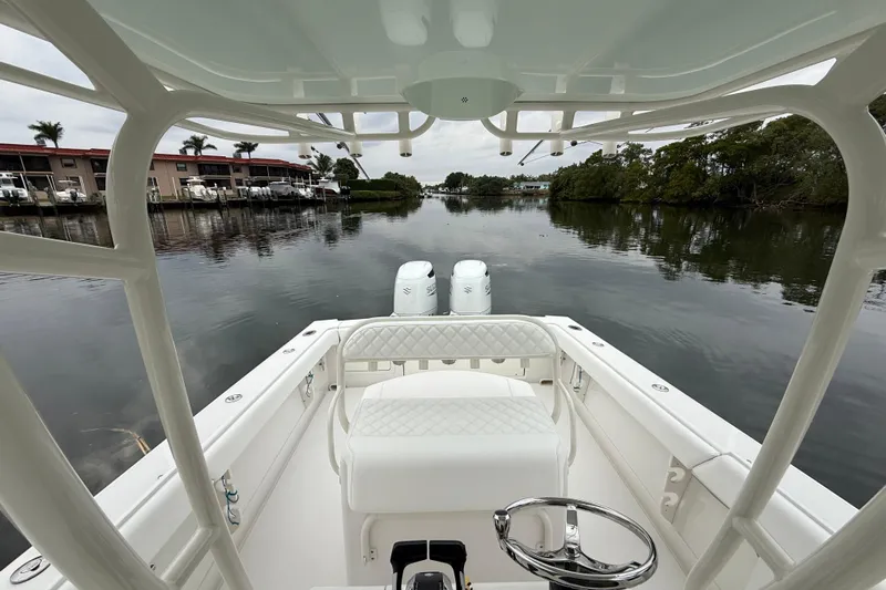  Yacht Photos Pics 2009 Jupiter 29 boat interior with dual engines on a calm waterway.