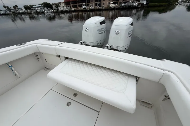  Yacht Photos Pics 2009 Jupiter 29 boat with dual Suzuki outboard motors on a calm waterfront.