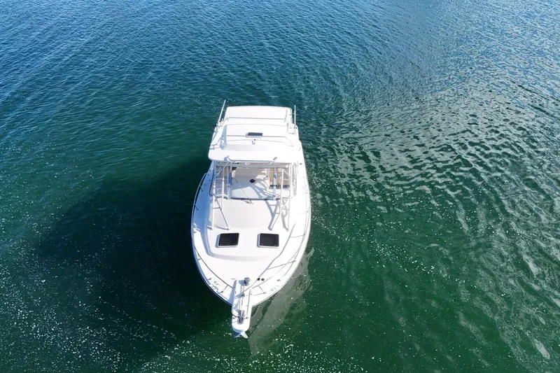  Yacht Photos Pics 2008 Grady-White Express 330 boat on calm blue water, aerial view.