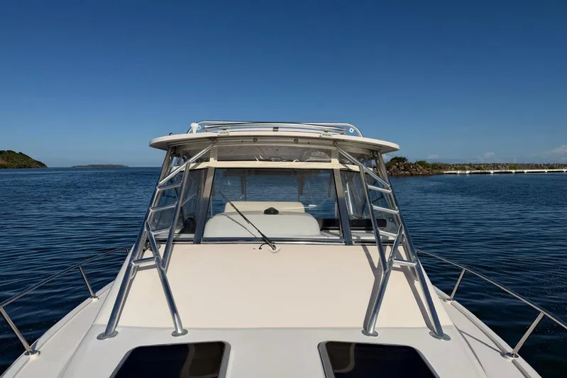  Yacht Photos Pics 2008 Grady-White Express 330 boat on calm water, clear blue sky background.