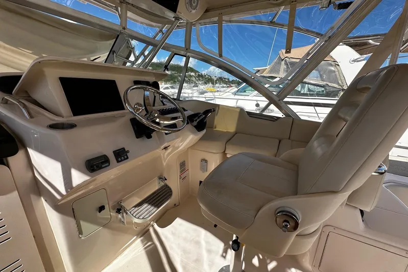  Yacht Photos Pics 2008 Grady-White Express 330 helm with steering wheel and comfortable seating.