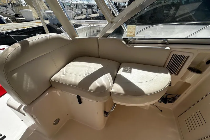  Yacht Photos Pics 2008 Grady-White Express 330 boat interior seating area with beige upholstery.