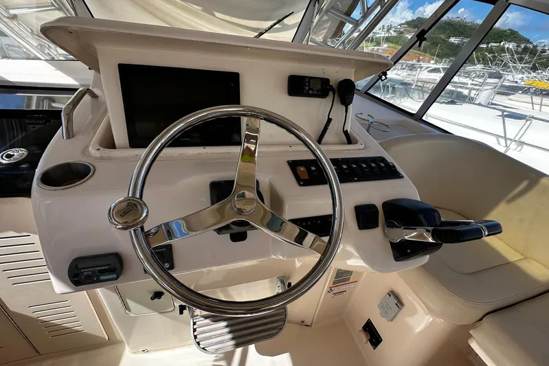  Yacht Photos Pics 2008 Grady-White Express 330 helm with steering wheel and control panel.