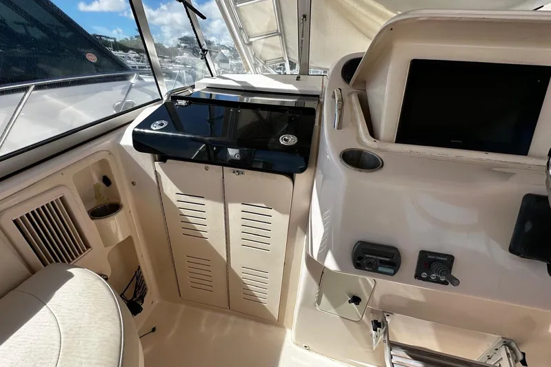  Yacht Photos Pics 2008 Grady-White Express 330 boat interior with control panel and seating area.