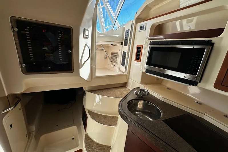  Yacht Photos Pics 2008 Grady-White Express 330 interior with kitchenette, microwave, and sink.