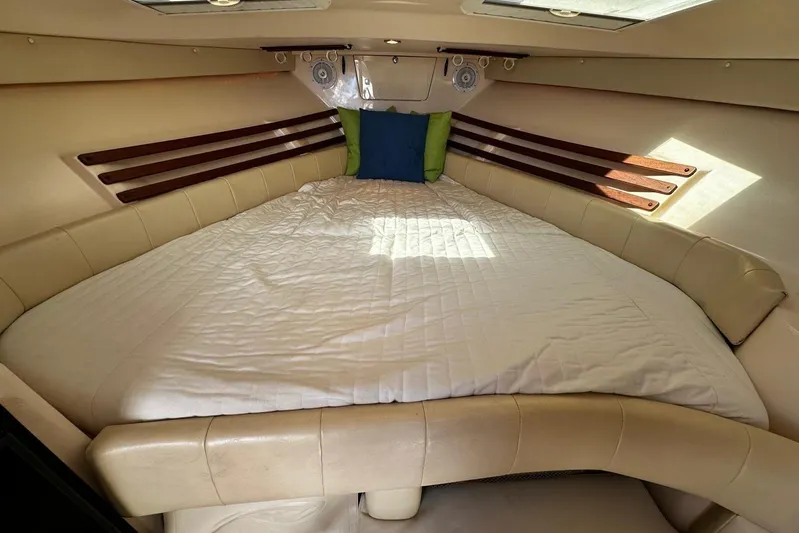  Yacht Photos Pics 2008 Grady-White Express 330 cabin interior with cozy bed and cushions.