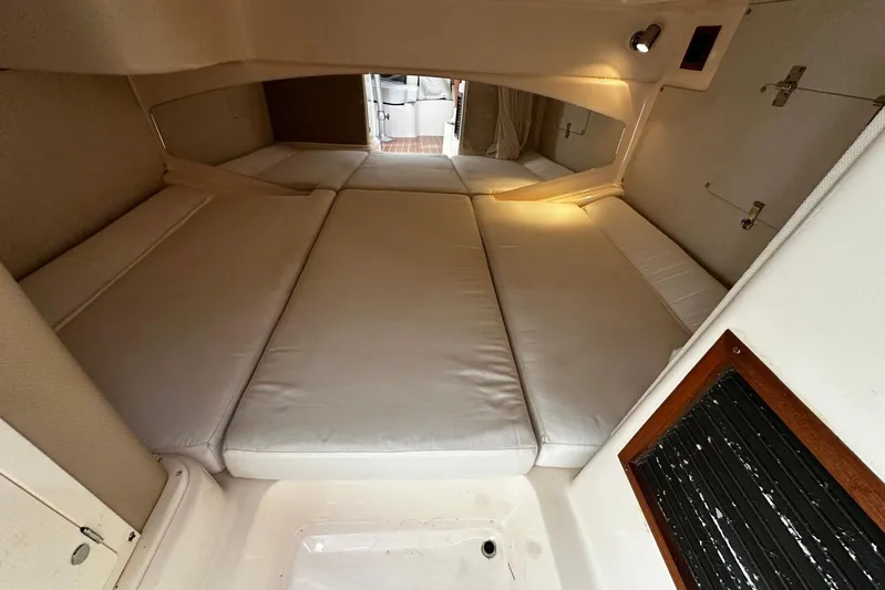  Yacht Photos Pics 2008 Grady-White Express 330 cabin interior with cushioned sleeping area.