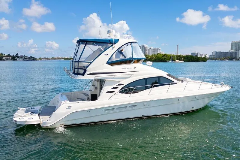 Lazy Days Yacht Photos Pics 2009 Sea Ray 44 Sedan Bridge yacht cruising on a sunny day.