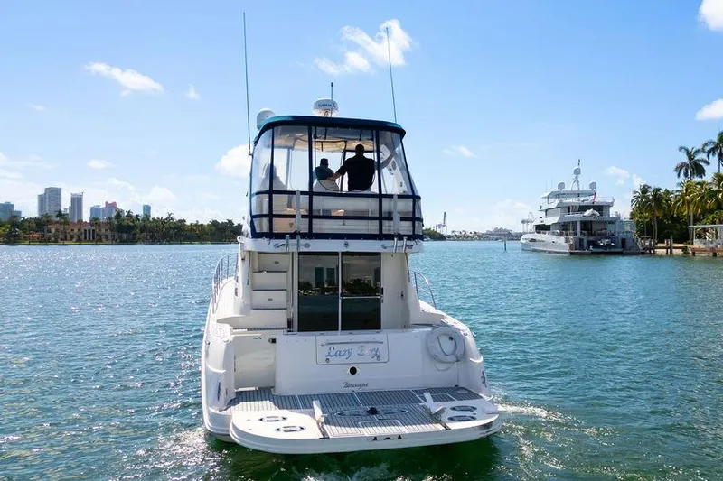 Lazy Days Yacht Photos Pics 2009 Sea Ray 44 Sedan Bridge yacht cruising on a sunny day.
