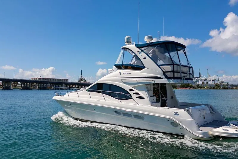 Lazy Days Yacht Photos Pics 2009 Sea Ray 44 Sedan Bridge yacht cruising on a sunny day.