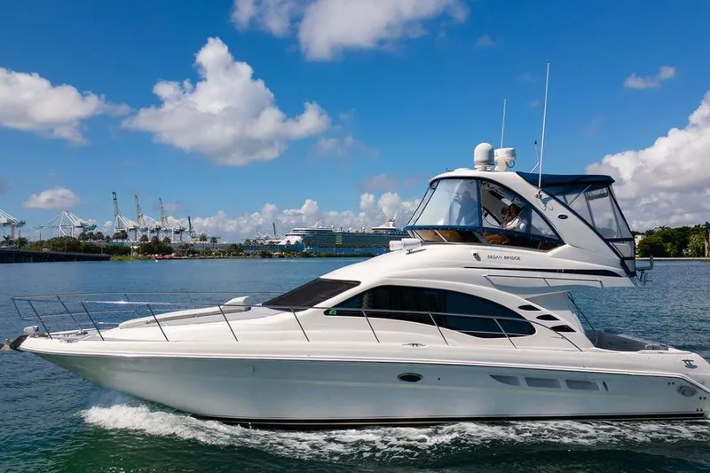 Lazy Days Yacht Photos Pics 2009 Sea Ray 44 Sedan Bridge yacht cruising on a sunny day.
