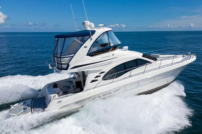 Lazy Days Yacht Photos Pics 2009 Sea Ray 44 Sedan Bridge yacht cruising on open water.