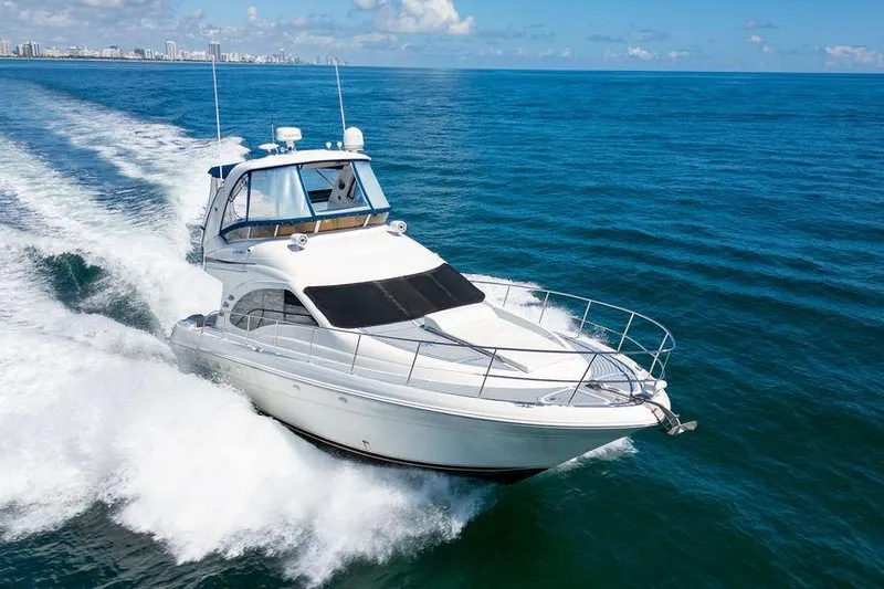 Lazy Days Yacht Photos Pics 2009 Sea Ray 44 Sedan Bridge yacht cruising on open ocean waters.
