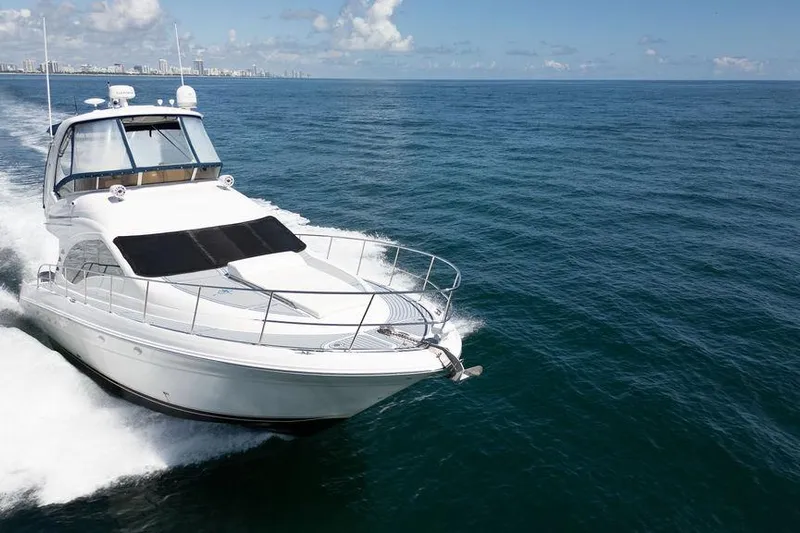 Lazy Days Yacht Photos Pics 2009 Sea Ray 44 Sedan Bridge yacht cruising on open ocean waters.