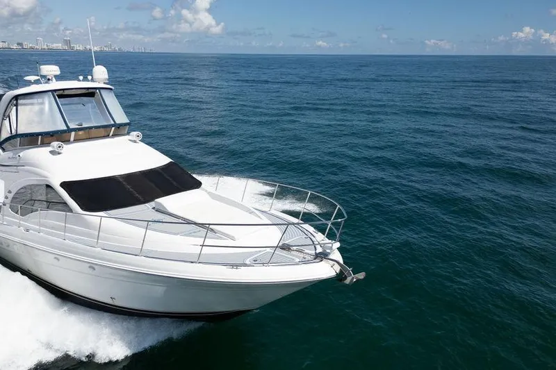 Lazy Days Yacht Photos Pics 2009 Sea Ray 44 Sedan Bridge yacht cruising on open ocean waters.