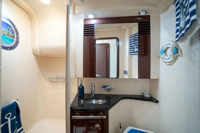 Lazy Days Yacht Photos Pics Luxurious bathroom interior of 2009 Sea Ray 44 Sedan Bridge yacht with nautical decor.