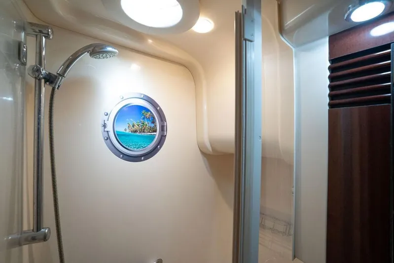 Lazy Days Yacht Photos Pics Luxurious 2009 Sea Ray 44 Sedan Bridge shower with porthole and modern fixtures.
