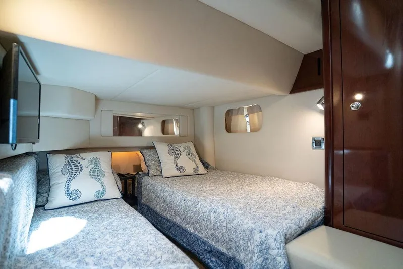 Lazy Days Yacht Photos Pics Luxurious cabin interior of 2009 Sea Ray 44 Sedan Bridge yacht with twin beds.