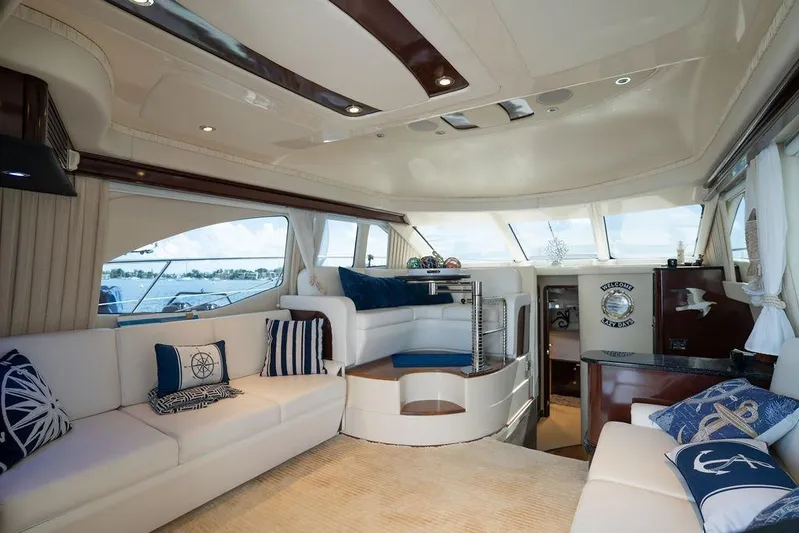Lazy Days Yacht Photos Pics Luxurious interior of 2009 Sea Ray 44 Sedan Bridge yacht with elegant seating and nautical decor.