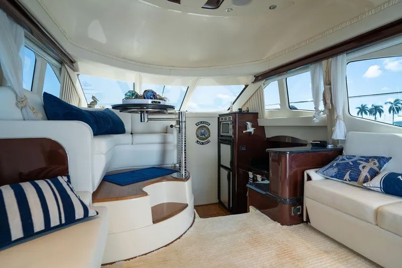 Lazy Days Yacht Photos Pics Luxurious interior of 2009 Sea Ray 44 Sedan Bridge yacht with elegant seating and decor.