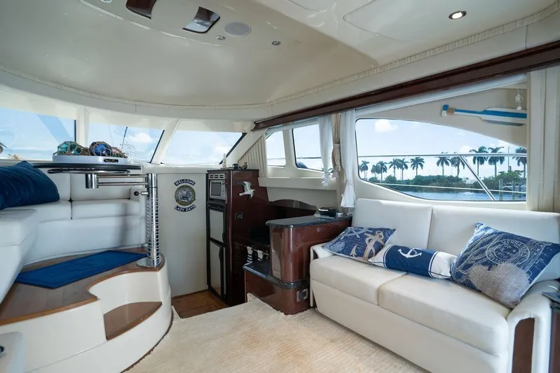 Lazy Days Yacht Photos Pics Luxurious interior of 2009 Sea Ray 44 Sedan Bridge yacht with elegant seating and decor.