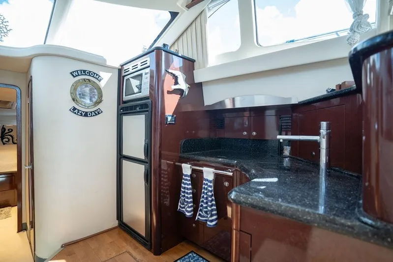 Lazy Days Yacht Photos Pics Luxurious 2009 Sea Ray 44 Sedan Bridge yacht interior with modern kitchen and elegant design.