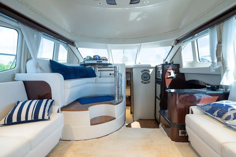 Lazy Days Yacht Photos Pics Luxurious interior of 2009 Sea Ray 44 Sedan Bridge yacht with elegant seating and decor.