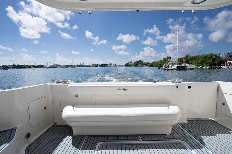 Lazy Days Yacht Photos Pics 2009 Sea Ray 44 Sedan Bridge yacht cruising on a sunny day with scenic water views.