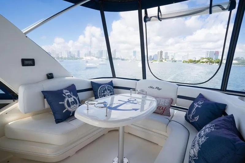 Lazy Days Yacht Photos Pics Luxurious 2009 Sea Ray 44 Sedan Bridge interior with scenic waterfront view.