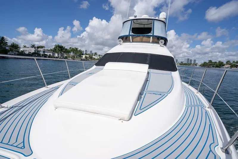 Lazy Days Yacht Photos Pics 2009 Sea Ray 44 Sedan Bridge yacht on water, sunny day, blue sky, luxury boating.