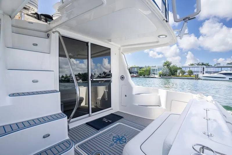 Lazy Days Yacht Photos Pics 2009 Sea Ray 44 Sedan Bridge yacht deck with waterfront view and modern design.