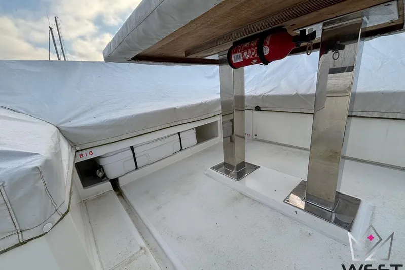 Albina Yacht Photos Pics 2018 Prestige 520 yacht deck with covered seating and mounted fire extinguisher.