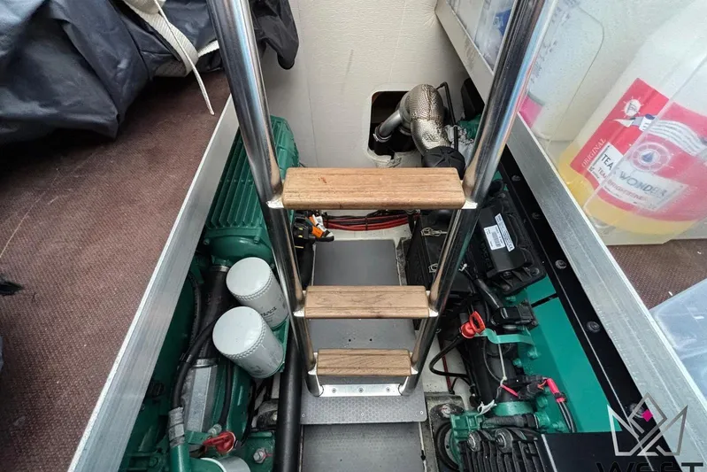 Albina Yacht Photos Pics Engine compartment of a 2018 Prestige 520 yacht with ladder and equipment.