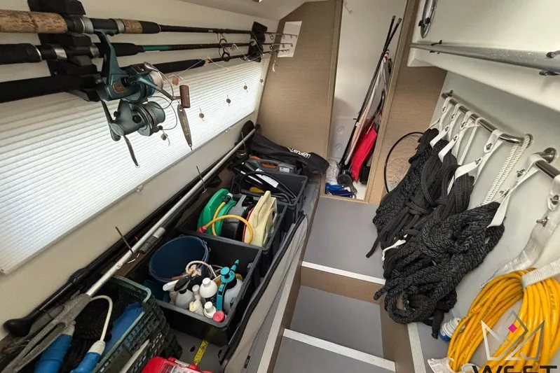 Albina Yacht Photos Pics Storage area in a 2018 Prestige 520 yacht with fishing gear and ropes.